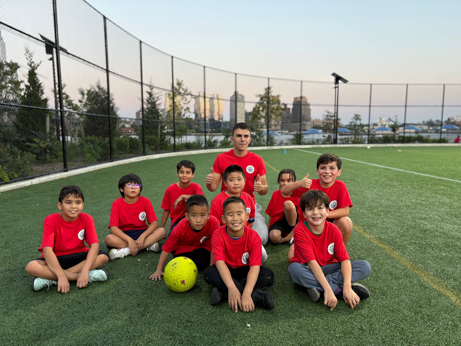 Coach Marko and Tirana Football Club youth players at East River Park