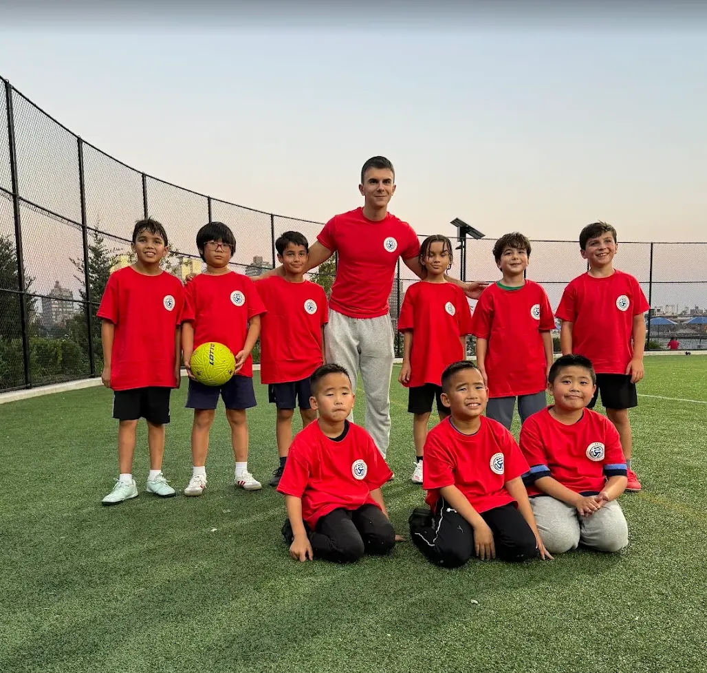 Coach Marko and youth soccer players training at East River Park